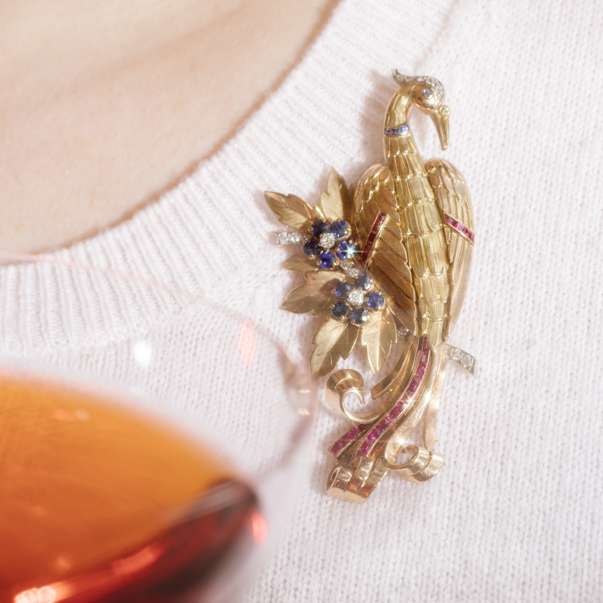 Expressive bird of paradise brooch in gold, rubies & diamonds, ca. 1950