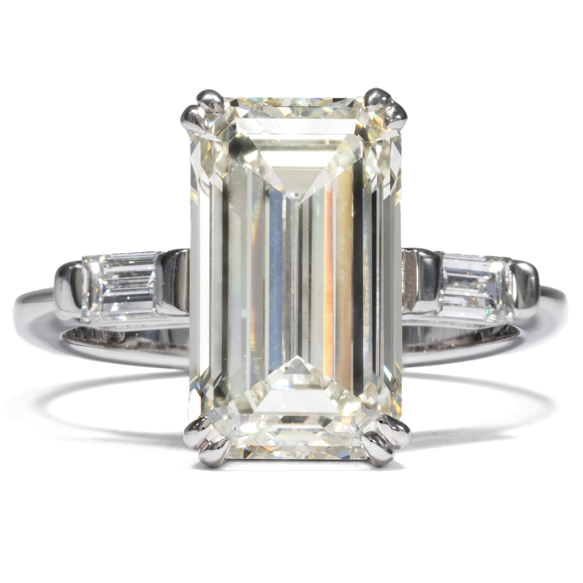 First class 5.30 ct emerald cut diamond in a white gold ring, ca. 2010