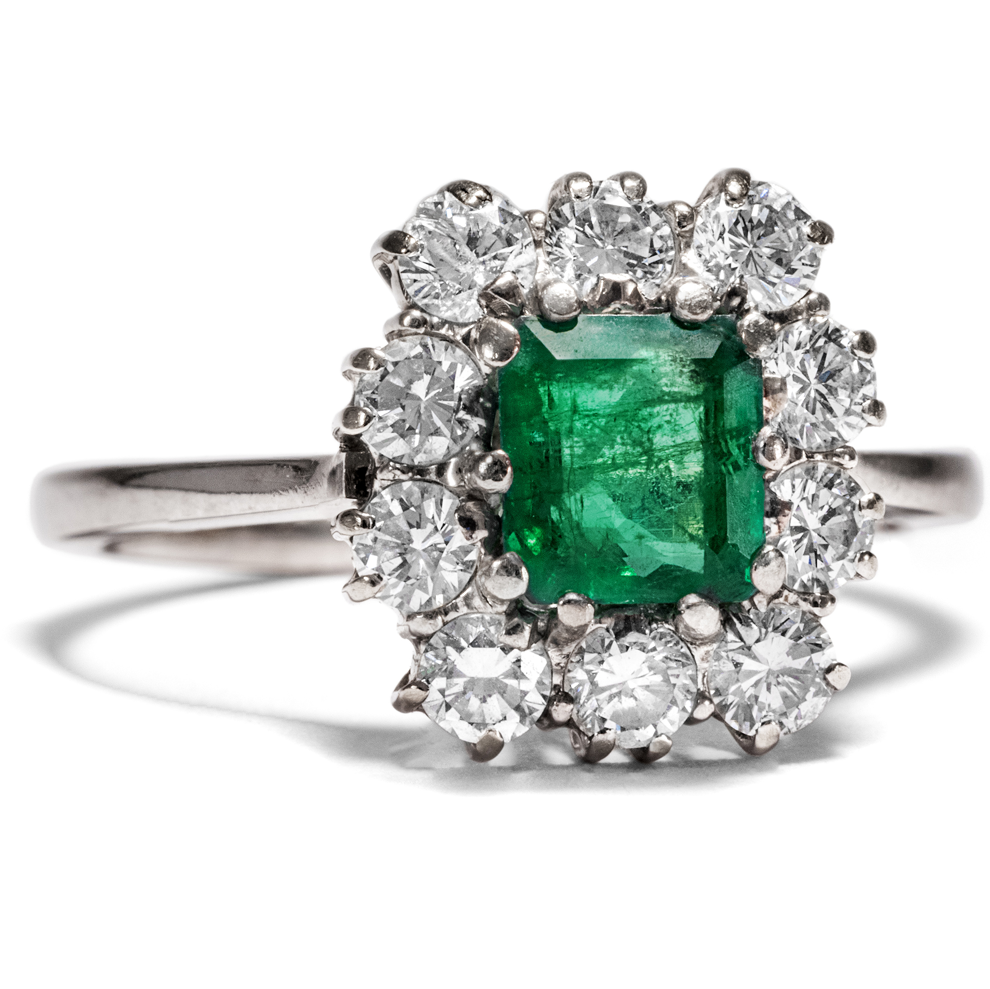 Vintage White Gold Ring with Emerald in an Entourage of Diamonds, ca. 1980