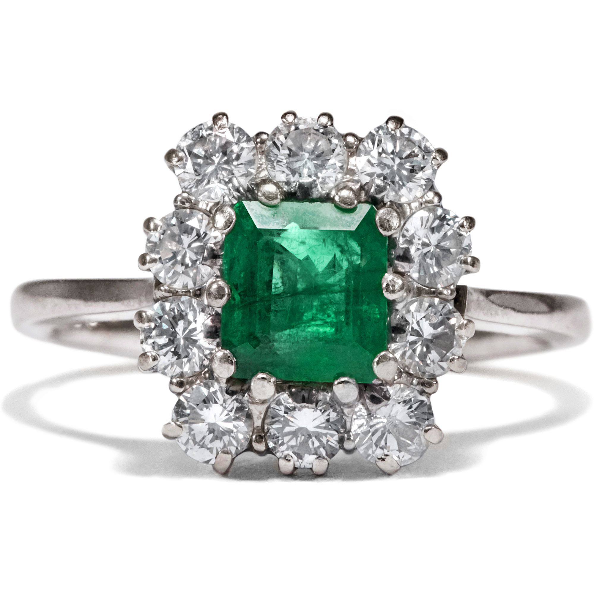 Vintage White Gold Ring with Emerald in an Entourage of Diamonds, ca. 1980