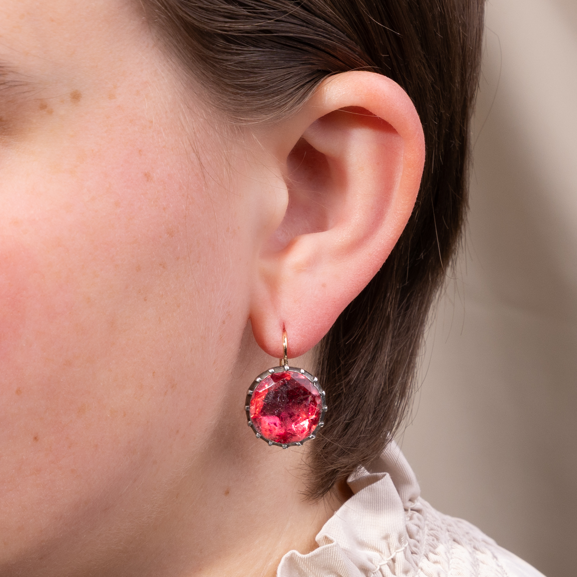 Earrings with antique buttons from around 1800, featuring pink-tinted glass stones, made in our workshop Earrings with antique buttons from around 1800, featuring pink-tinted glass stones, made in our workshop