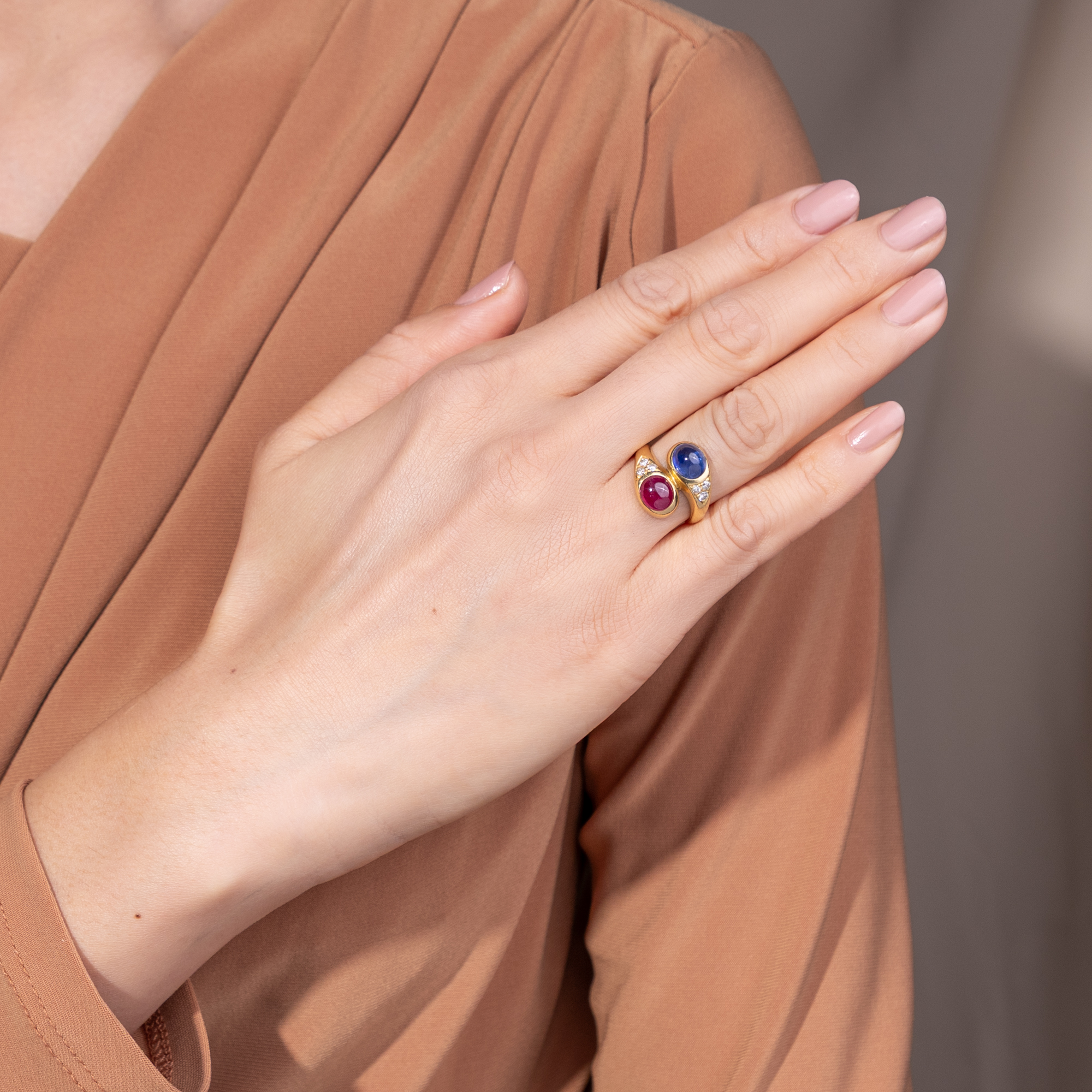 Fine Crossover Ring with Ruby, Sapphire, and Diamonds in Gold, c. 1990 Fine Crossover Ring with Ruby, Sapphire, and Diamonds in Gold, c. 1990